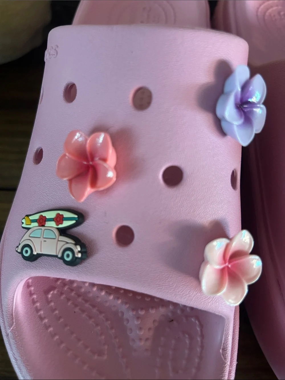 Crocs Pink stomp slides with charms